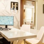 Clean Office - Turned-on Black Flat Screen Monitor on White Wooden Table and Chairs